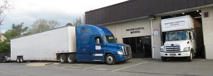 These are two of our moving trucks which are parked in front of our storage facility.