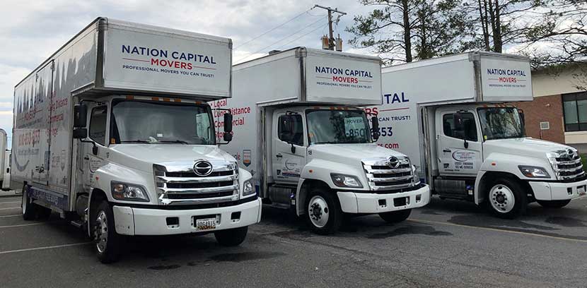 Three of our moving trucks are parked and ready for the next relocation.